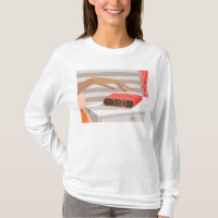 Womans hand pushing on alarm clock snooze button