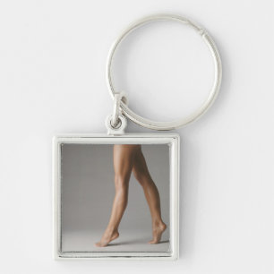 Woman's legs key ring