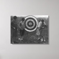 Women examining Archery Target Photograph
