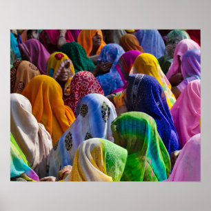 Women in colourful saris gather together poster