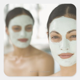 Women smiling in beauty mud masks square sticker