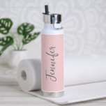 Womens Stylish Blush Pink Script Personalised Water Bottle<br><div class="desc">Stay hydrated during you gym workout with this Women's Stylish Blush Pink Script Personalised Water Bottle. It is trendy modern designed with a pastel pink background around the bottle. Name is in light grey hand script lettering vertical on centre front. Perfect gift idea for her! CLICK PERSONALIZE TEMPLATE OPTION AND...</div>
