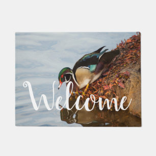 Wood duck on the shore doormat