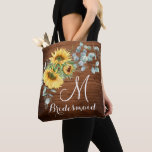 Wood Sunflower Eucalyptus Rustic Wedding Tote Bag<br><div class="desc">Give your bridal party a tote bag that'll make them feel totally flattered! These totes come customised to say anything that you'd like. For further customisation, please click the "customise further" link and use our design tool to modify this template. If you need help or matching items, please contact me....</div>