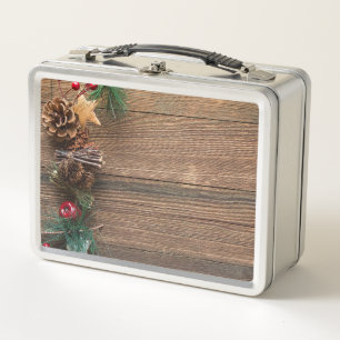 wooden background with pine cones       metal lunch box
