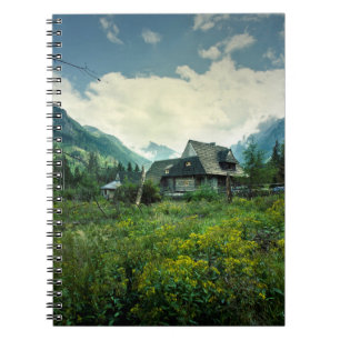 Wooden house, mountain nature scenery. notebook