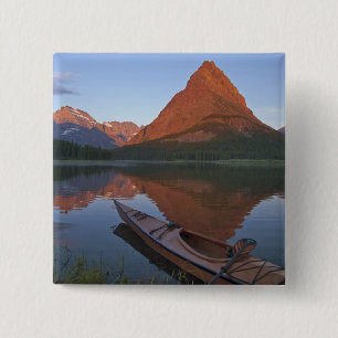 Wooden kayak in Swiftcurrent Lake at sunrise in 15 Cm Square Badge