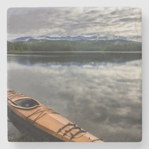 Wooden kayak on shore of Beaver Lake Stone Coaster