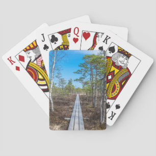 Wooden trail over swamp playing cards