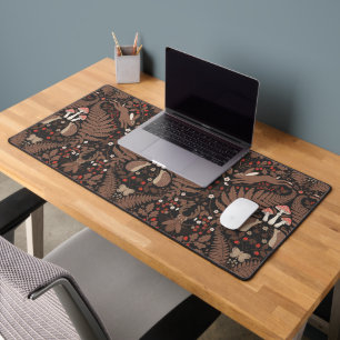 Woodland animals and plants in red and brown desk mat