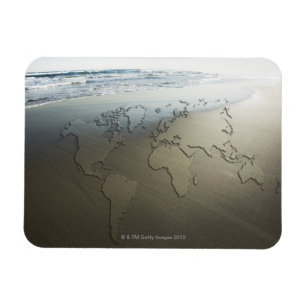 World map on sand magnet