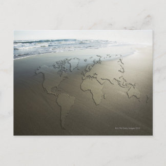 World map on sand postcard