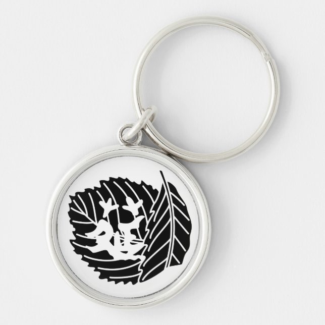 Worm-eaten folded oak leaf crest key ring (Front)