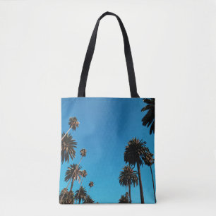 Worm's eye view of trees tote bag