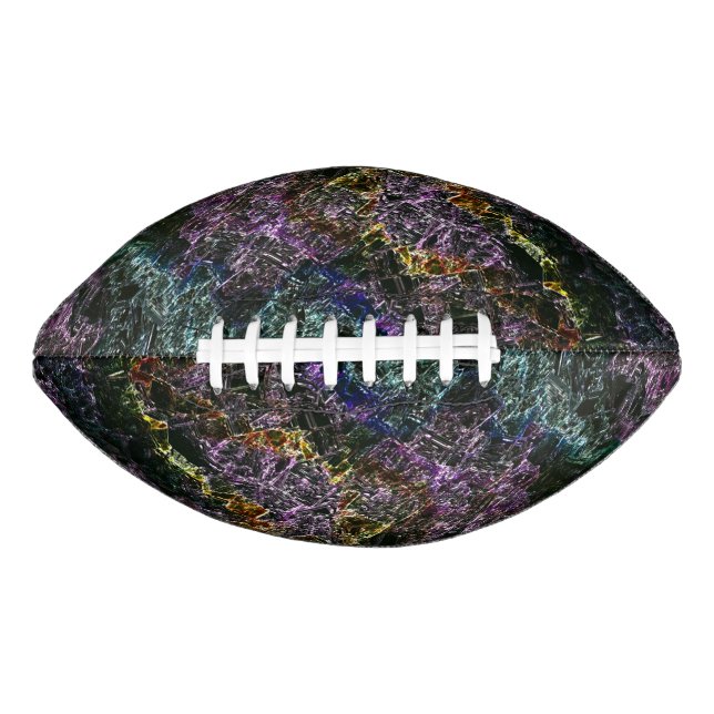 Worn, destroyed or corroded dark coloured sponge f football (Front)