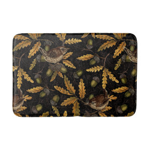 Wrens and acorns on black bath mat