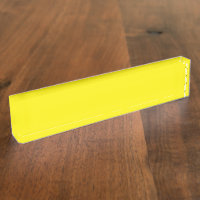 Yellow and orange abstract shapes overlap on a pla