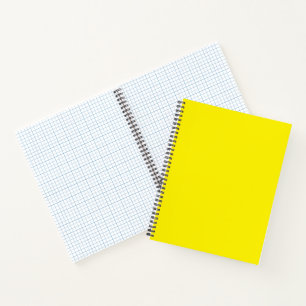 Yellow and orange abstract shapes overlap on a pla notebook
