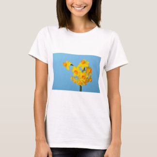 Yellow and orange daffodils on blue background T-Shirt
