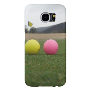 yellow and pink golf balls,