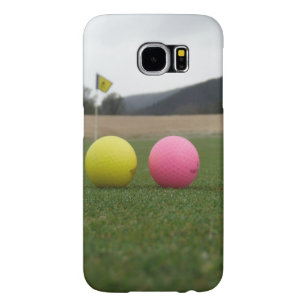 yellow and pink golf balls,