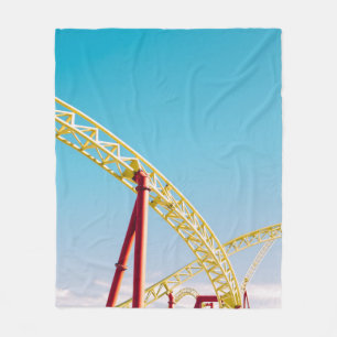 Yellow and red roller coaster under blue sky at da fleece blanket