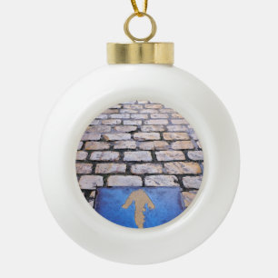 Yellow arrow ceramic ball christmas ornament