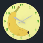 YELLOW BANANA IN POP ART STYLE WITH GREEN NUMBERS LARGE CLOCK<br><div class="desc">A light yellow Clock with green numbers,  and a digital illustration of a tropical banana. Available in other options. Visit our store for more Wall Clocks and other Home Gifts.</div>
