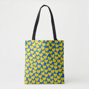 Yellow blue hearts background  tote bag