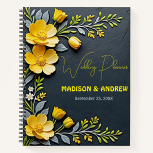 Yellow buttercup flower and grey wedding notebook
