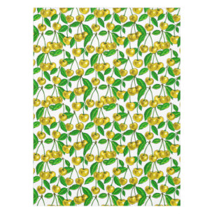 Yellow cherries on white tablecloth