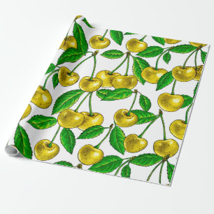 Yellow cherries on white wrapping paper