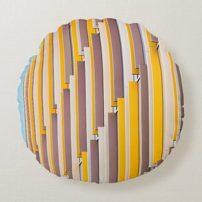 YELLOW CONCRETE BUILDING DURING DAYTIME ROUND CUSHION (Front)