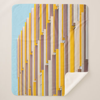 YELLOW CONCRETE BUILDING DURING DAYTIME SHERPA BLANKET