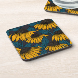 Yellow coneflowers on dark blue coaster