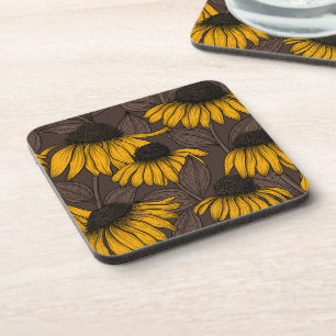 Yellow coneflowers on dark brown coaster