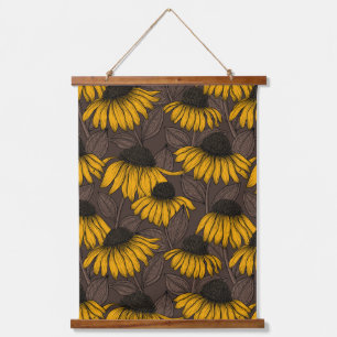 Yellow coneflowers on dark brown hanging tapestry