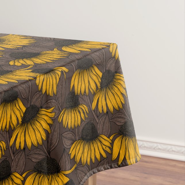 Yellow coneflowers on dark brown tablecloth (In Situ)