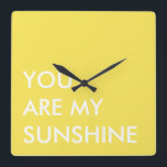 Yellow Custom Text Art You Are My Sunshine Square Wall Clock<br><div class="desc">Bright yellow and white custom text art "You Are My Sunshine" wall clock quote. Minimalist wall decor square clock design, by red_dress, featuring the white text "You Are My Sunshine" on a yellow background. Easily personalise "You Are My Sunshine" wall decor clocks with your favourite colours, quotes and fonts. Click...</div>