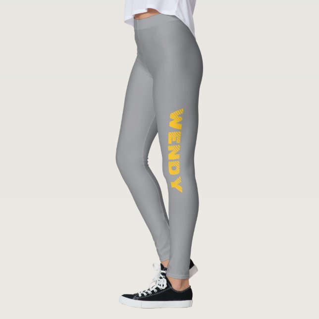 Yellow faded custom text on grey  leggings (Left)