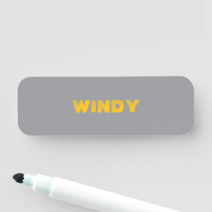 Yellow faded custom text on grey name tag