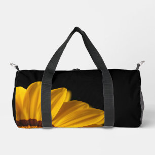 Yellow flower on  black background duffle bag