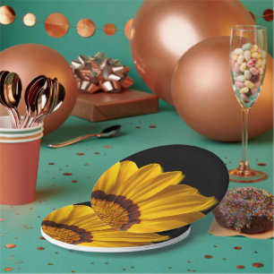 Yellow flower on black background paper plate