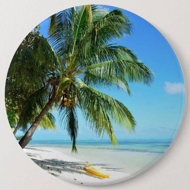Yellow kayak on a white sand beach button (Front)