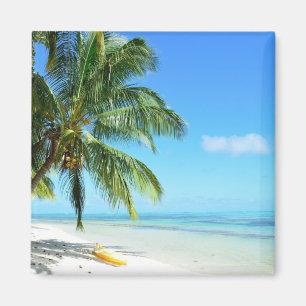 Yellow kayak on a white sand beach magnet