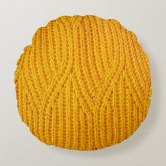 Yellow knitted surface textile material background round cushion