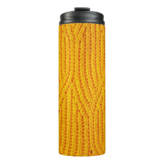 Yellow knitted surface textile material background thermal tumbler