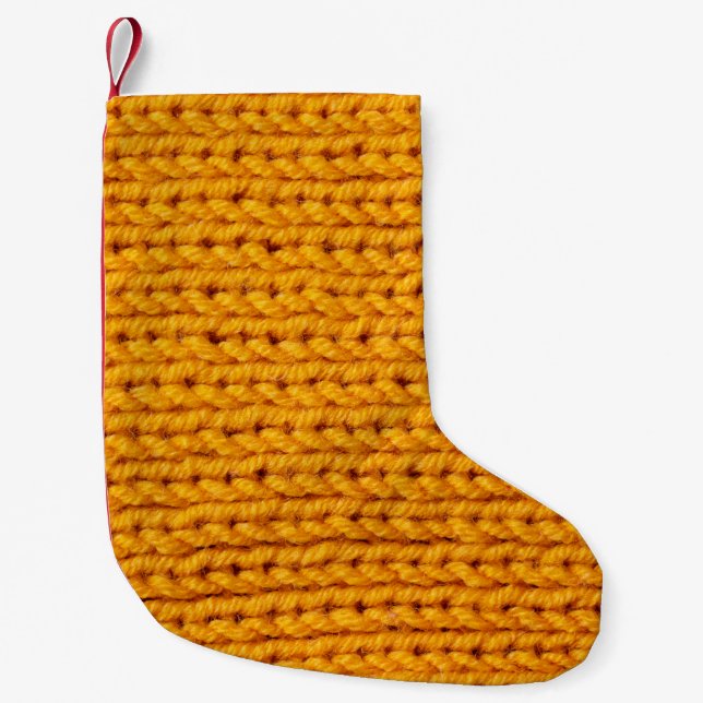 Yellow knitted wool texture background pattern wit small christmas stocking (Front)