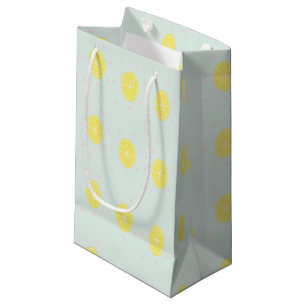Yellow lemon slices on blue small gift bag