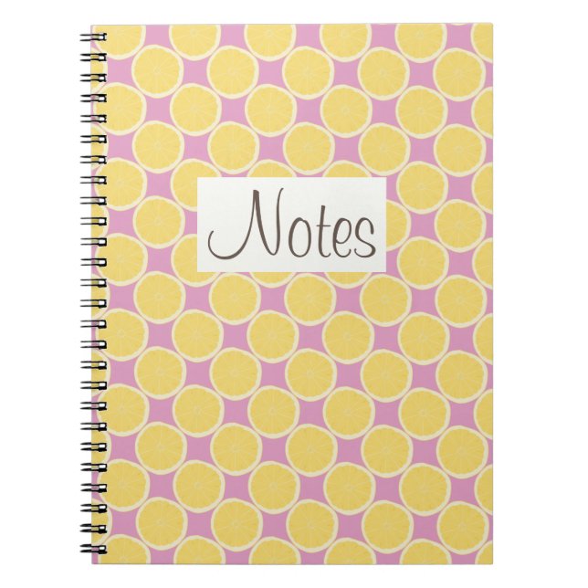 Yellow lemon slices on bright pink spiral notebook (Front)
